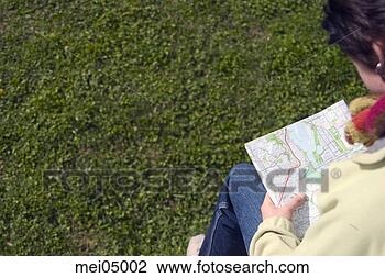 Stock Photo - person consulting 
map. fotosearch 
- search stock 
photos, pictures, 
images, and photo 
clipart
