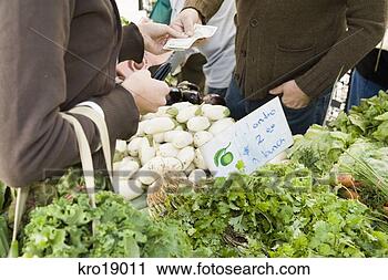 Stock Photography - person paying 
at vegetable stand. 
fotosearch - search 
stock photos, 
pictures, images, 
and photo clipart