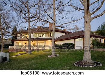 Stock Photo - rear exterior 
of country style 
home at twilight. 
fotosearch - search 
stock photos, 
pictures, images, 
and photo clipart