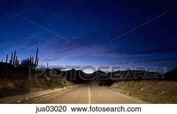 Stock Photography - remote highway 
at night. fotosearch 
- search stock 
photos, pictures, 
images, and photo 
clipart