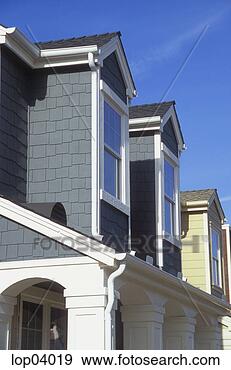 Stock Photograph - row of houses 
in a traditional 
american suburb. 
fotosearch - search 
stock photos, 
pictures, images, 
and photo clipart