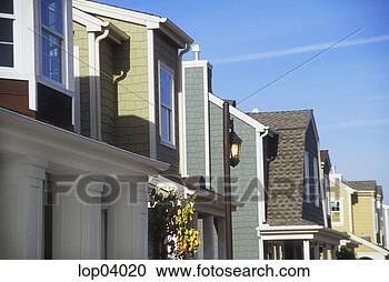 Stock Photography - row of houses 
in a traditional 
american suburb. 
fotosearch - search 
stock photos, 
pictures, images, 
and photo clipart