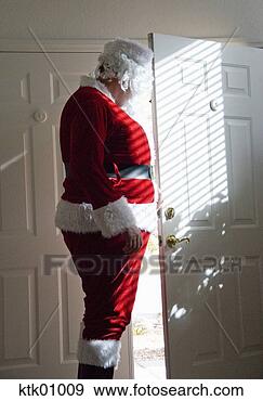 Stock Photograph - santa claus looking 
out door. fotosearch 
- search stock 
photos, pictures, 
images, and photo 
clipart