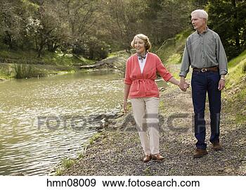 Stock Photograph - senior couple 
holding hands. 
fotosearch - search 
stock photos, 
pictures, images, 
and photo clipart