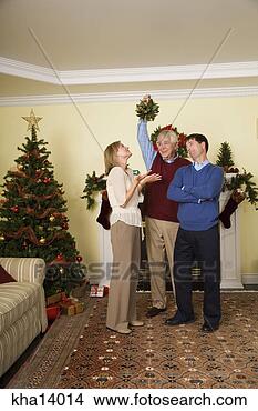 Stock Photo - senior man holding 
mistletoe for 
husband and wife. 
fotosearch - search 
stock photos, 
pictures, images, 
and photo clipart