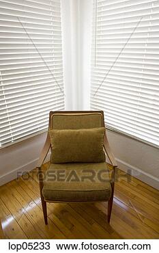 Stock Photo - single armchair 
in corner. fotosearch 
- search stock 
photos, pictures, 
images, and photo 
clipart
