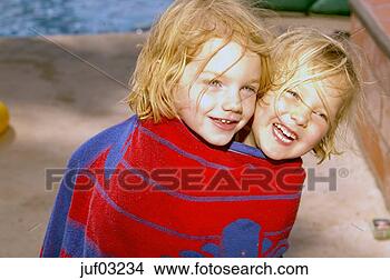 Stock Photo - sisters wrapped 
in same towel. 
fotosearch - search 
stock photos, 
pictures, images, 
and photo clipart