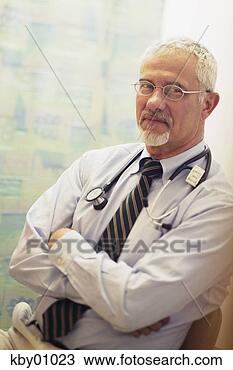 Stock Photo - smiling doctor 
crossing arms. 
fotosearch - search 
stock photos, 
pictures, images, 
and photo clipart