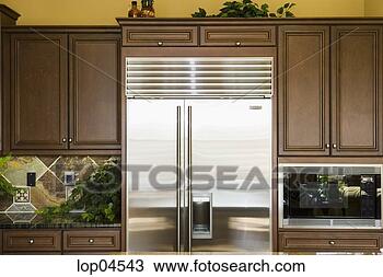 Stock Photo - stainless steel 
refrigerator in 
kitchen. fotosearch 
- search stock 
photos, pictures, 
images, and photo 
clipart