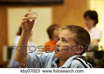 Stock Photo - student examining 
jar. fotosearch 
- search stock 
photos, pictures, 
images, and photo 
clipart