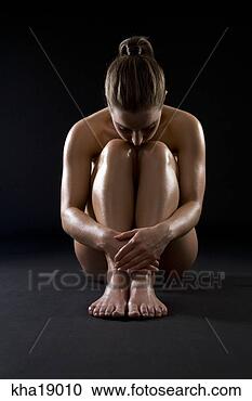 Stock Photography - studio shot of 
naked woman hugging 
knees. fotosearch 
- search stock 
photos, pictures, 
images, and photo 
clipart