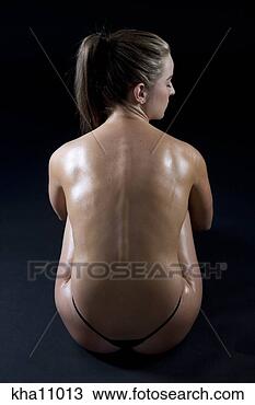 Stock Photo - studio shot of 
young woman's 
oiled back. fotosearch 
- search stock 
photos, pictures, 
images, and photo 
clipart