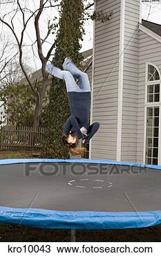 Stock Photo - teenage girl doing 
backflip on trampoline. 
fotosearch - search 
stock photos, 
pictures, images, 
and photo clipart