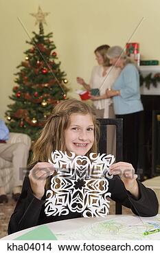 Stock Photo - teenage girl displaying 
christmas snowflake. 
fotosearch - search 
stock photos, 
pictures, images, 
and photo clipart