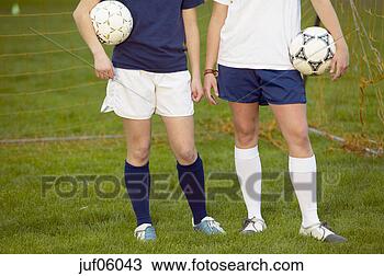 Stock Photo - teenage girls 
holding soccer 
balls. fotosearch 
- search stock 
photos, pictures, 
images, and photo 
clipart