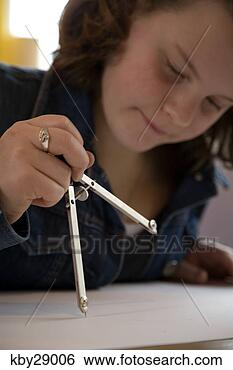 Stock Photo - teenager using 
a protractor. 
fotosearch - search 
stock photos, 
pictures, images, 
and photo clipart