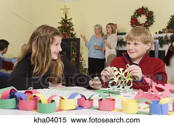 Stock Image - teenagers making 
christmaas snowflakes. 
fotosearch - search 
stock photos, 
pictures, images, 
and photo clipart