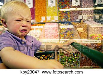 Picture - toddler boy crying 
in candy aisle 
of grocery store. 
fotosearch - search 
stock photos, 
pictures, images, 
and photo clipart