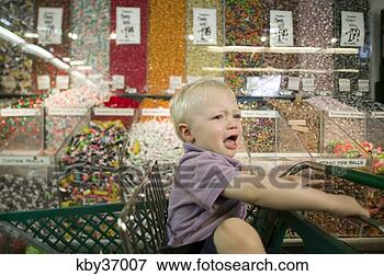 Picture - toddler boy crying 
in candy aisle 
of grocery store. 
fotosearch - search 
stock photos, 
pictures, images, 
and photo clipart