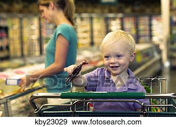 Stock Photograph - toddler boy playing 
with toy in shopping 
cart. fotosearch 
- search stock 
photos, pictures, 
images, and photo 
clipart