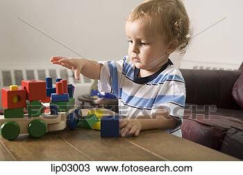 Stock Photo - toddler boy playing 
with blocks. fotosearch 
- search stock 
photos, pictures, 
images, and photo 
clipart