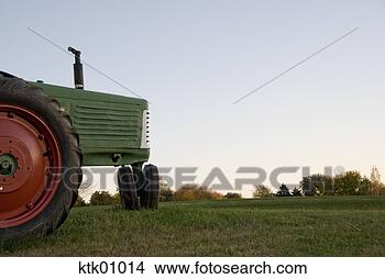 Stock Photo - tractor in field. 
fotosearch - search 
stock photos, 
pictures, images, 
and photo clipart