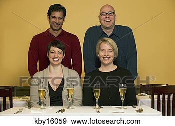 Stock Photograph - two boyfriends 
pulling chairs 
out for their 
girlfriends. fotosearch 
- search stock 
photos, pictures, 
images, and photo 
clipart