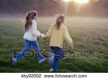 Stock Photo - two girls running 
holding hands. 
fotosearch - search 
stock photos, 
pictures, images, 
and photo clipart