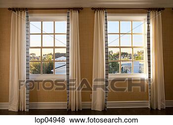Stock Photo - two windows with 
long curtains. 
fotosearch - search 
stock photos, 
pictures, images, 
and photo clipart