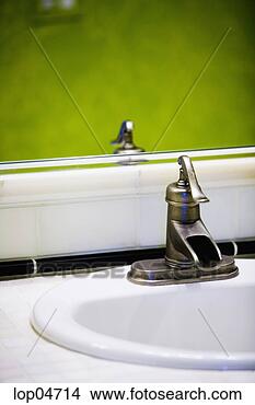 Stock Photo - unique faucet 
in green bathroom. 
fotosearch - search 
stock photos, 
pictures, images, 
and photo clipart