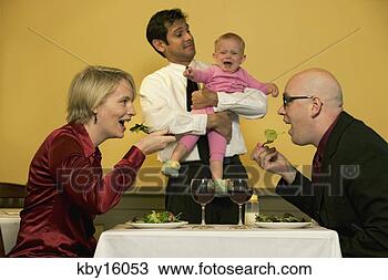 Stock Photo - waiter holding 
crying baby while 
parents eat. fotosearch 
- search stock 
photos, pictures, 
images, and photo 
clipart