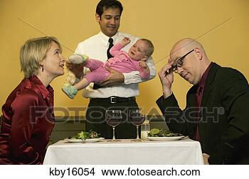 Stock Photo - waiter holding 
crying baby while 
parents try to 
eat. fotosearch 
- search stock 
photos, pictures, 
images, and photo 
clipart
