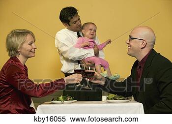 Stock Image - waiter holding 
crying baby while 
parents toast 
drinks. fotosearch 
- search stock 
photos, pictures, 
images, and photo 
clipart