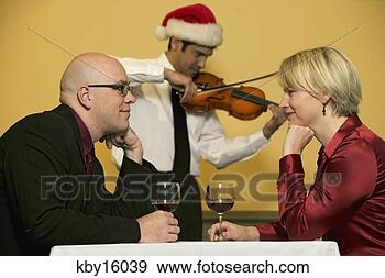 Stock Photograph - waiter playing 
romantic music 
for couple. fotosearch 
- search stock 
photos, pictures, 
images, and photo 
clipart