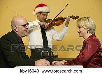 Stock Photography - waiter playing 
romantic music 
for couple. fotosearch 
- search stock 
photos, pictures, 
images, and photo 
clipart