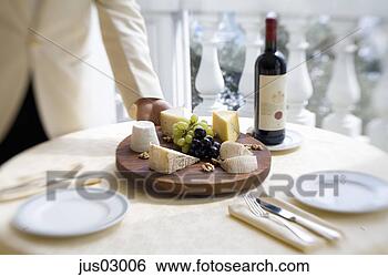 Stock Photo - waiter serving 
platter of cheese 
and fruit. fotosearch 
- search stock 
photos, pictures, 
images, and photo 
clipart