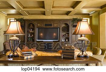 Stock Photo - warm, cozy family 
room with large 
television. fotosearch 
- search stock 
photos, pictures, 
images, and photo 
clipart