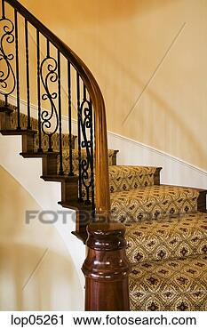 Stock Photography - winding staircase 
with wrought iron 
railing. fotosearch 
- search stock 
photos, pictures, 
images, and photo 
clipart