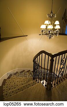 Stock Image - winding staircase 
with wrought iron 
railing. fotosearch 
- search stock 
photos, pictures, 
images, and photo 
clipart