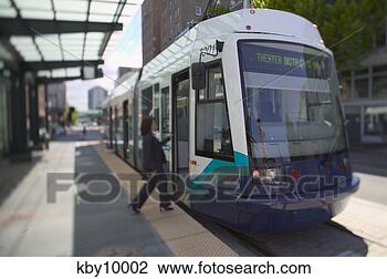 Stock Photo - woman boarding 
city train. fotosearch 
- search stock 
photos, pictures, 
images, and photo 
clipart