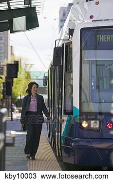 Stock Photo - woman boarding 
city train. fotosearch 
- search stock 
photos, pictures, 
images, and photo 
clipart