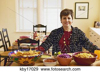 Stock Photograph - woman cooking 
dinner. fotosearch 
- search stock 
photos, pictures, 
images, and photo 
clipart