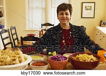 Stock Photography - woman cooking 
dinner. fotosearch 
- search stock 
photos, pictures, 
images, and photo 
clipart