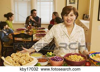 Stock Photo - woman cooking 
dinner. fotosearch 
- search stock 
photos, pictures, 
images, and photo 
clipart