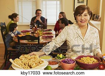 Stock Photo - woman cooking 
dinner. fotosearch 
- search stock 
photos, pictures, 
images, and photo 
clipart