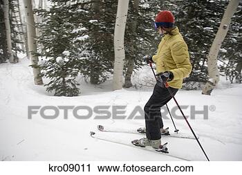 Stock Photography - woman cross-country 
skiing. fotosearch 
- search stock 
photos, pictures, 
images, and photo 
clipart