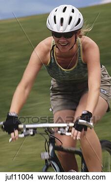 Stock Photo - woman cycling. 
fotosearch - search 
stock photos, 
pictures, images, 
and photo clipart