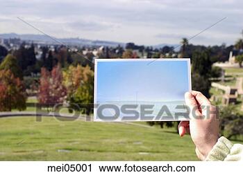 Stock Photography - woman holding 
photo over landscape. 
fotosearch - search 
stock photos, 
pictures, images, 
and photo clipart