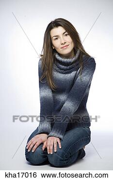 Stock Photo - woman kneeling 
on ground. fotosearch 
- search stock 
photos, pictures, 
images, and photo 
clipart