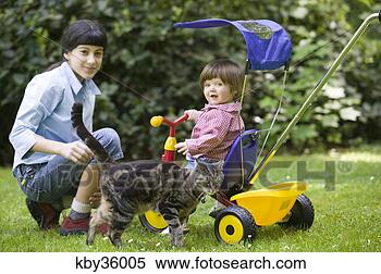 Stock Image - woman playing 
with son in backyard. 
fotosearch - search 
stock photos, 
pictures, images, 
and photo clipart